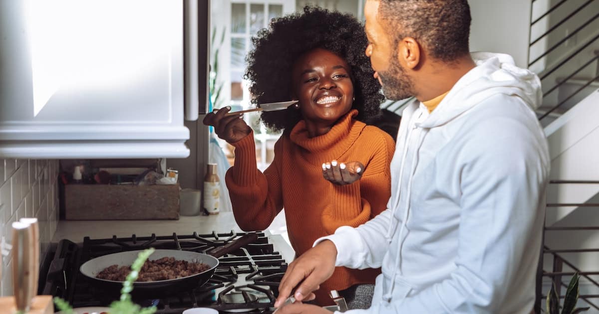 man and woman cooking