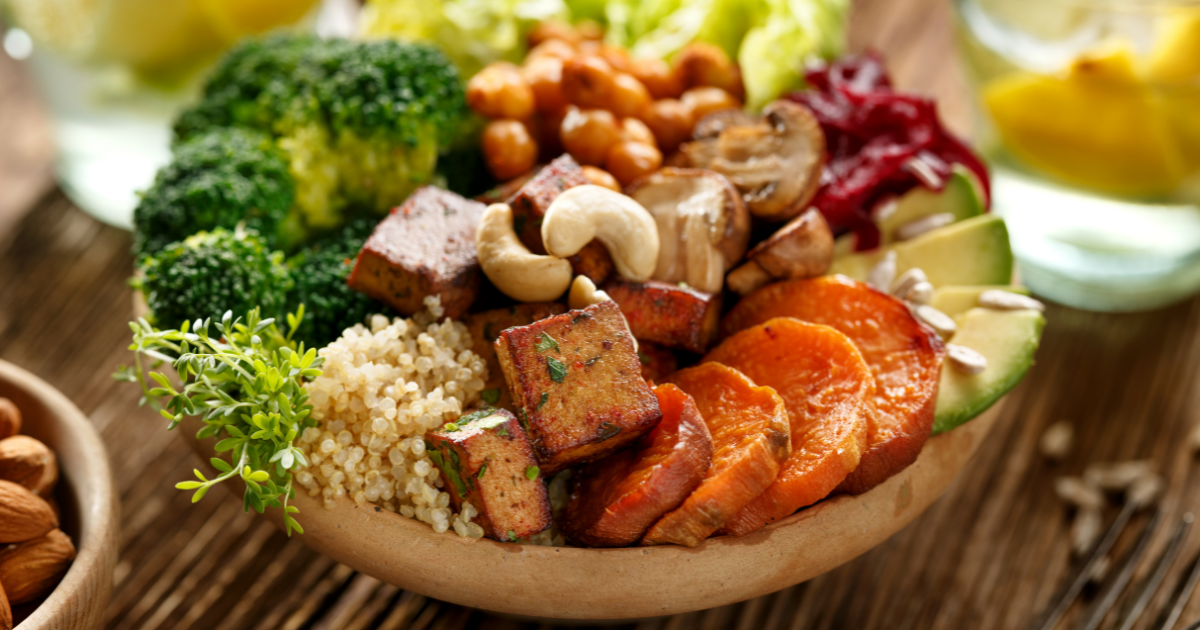 Vegan buddha bowl with tofu, couscous and mixed veggies
