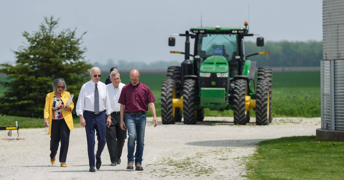 Joe Biden walks on a farm