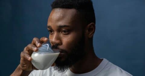 Man drinking glass of milk