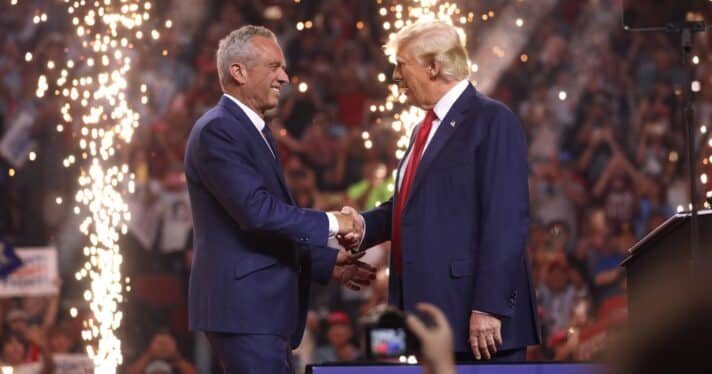 Robert F. Kennedy Jr. and Donald Trump shake hands