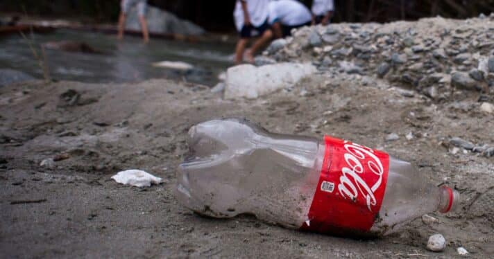 Close up of discarded plastic Coca-Cola bottle