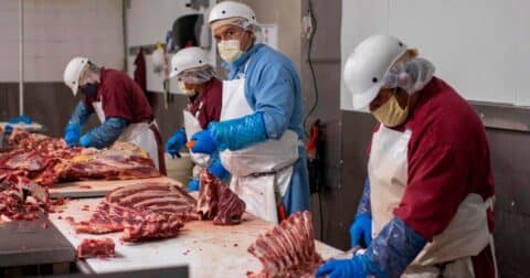 Butchers chop up beef at Jones Meat & Food Services in Rigby, Idaho