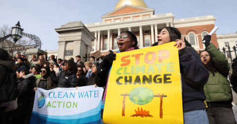 A group of students with signs in a justice rally