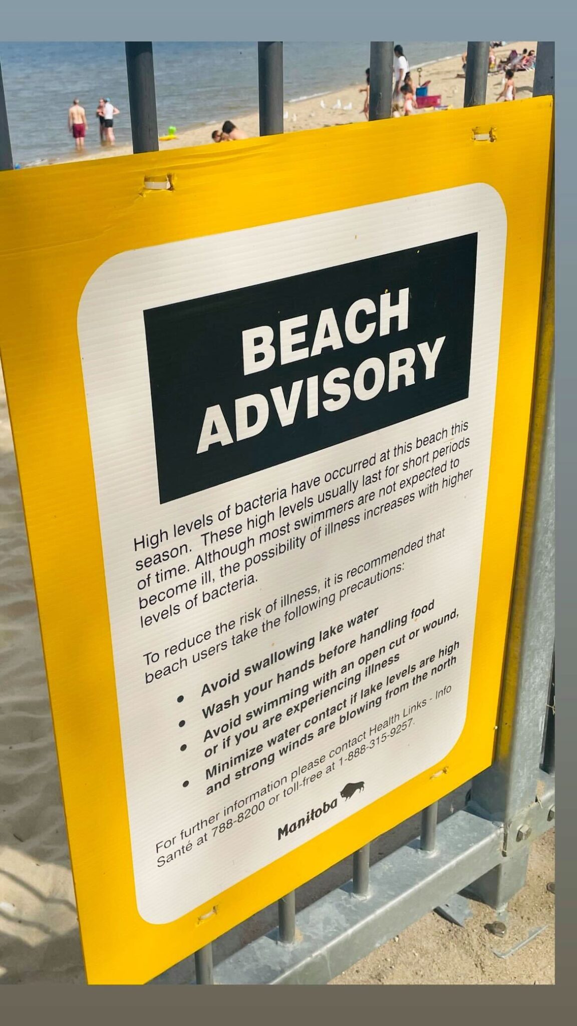 A beach advisory warning sign