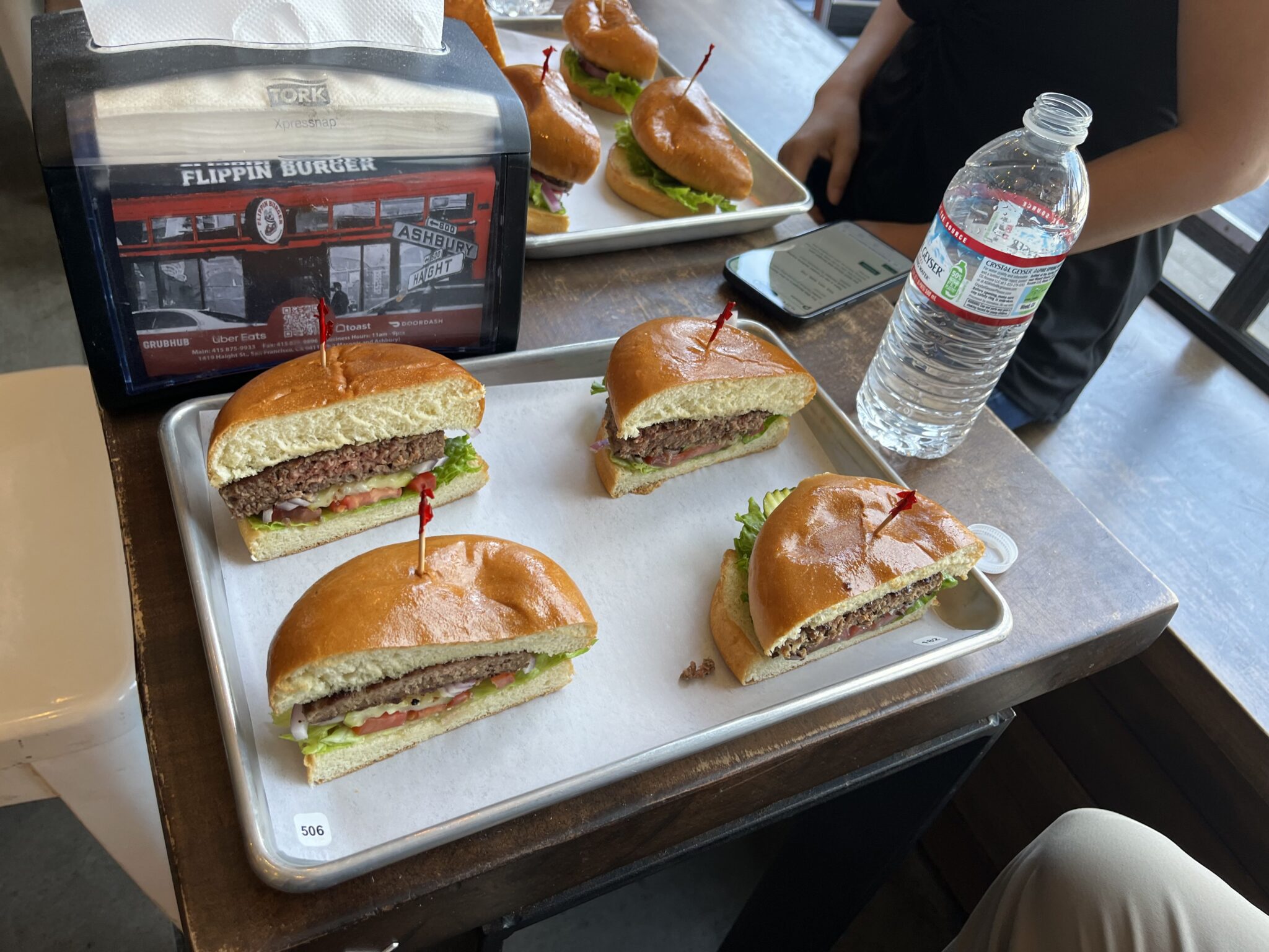 Two halved burgers on a platter
