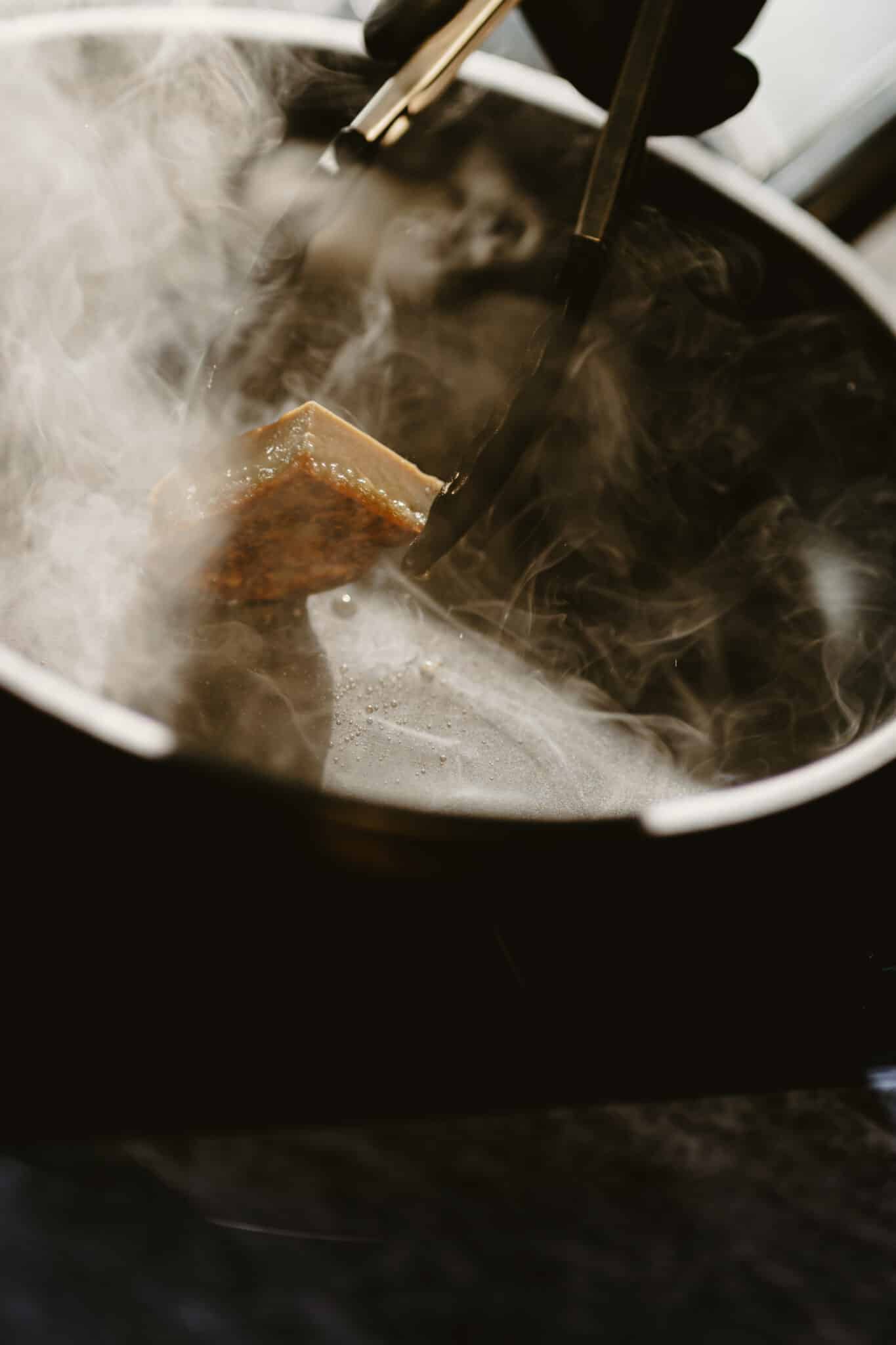 A plant-based meat being seared
