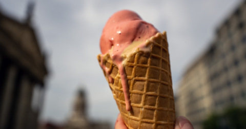 Melting strawberry ice cream in a waffle cone