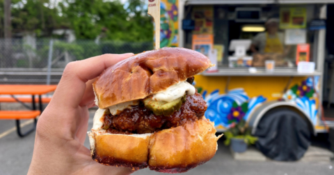 A burger in someone's hand