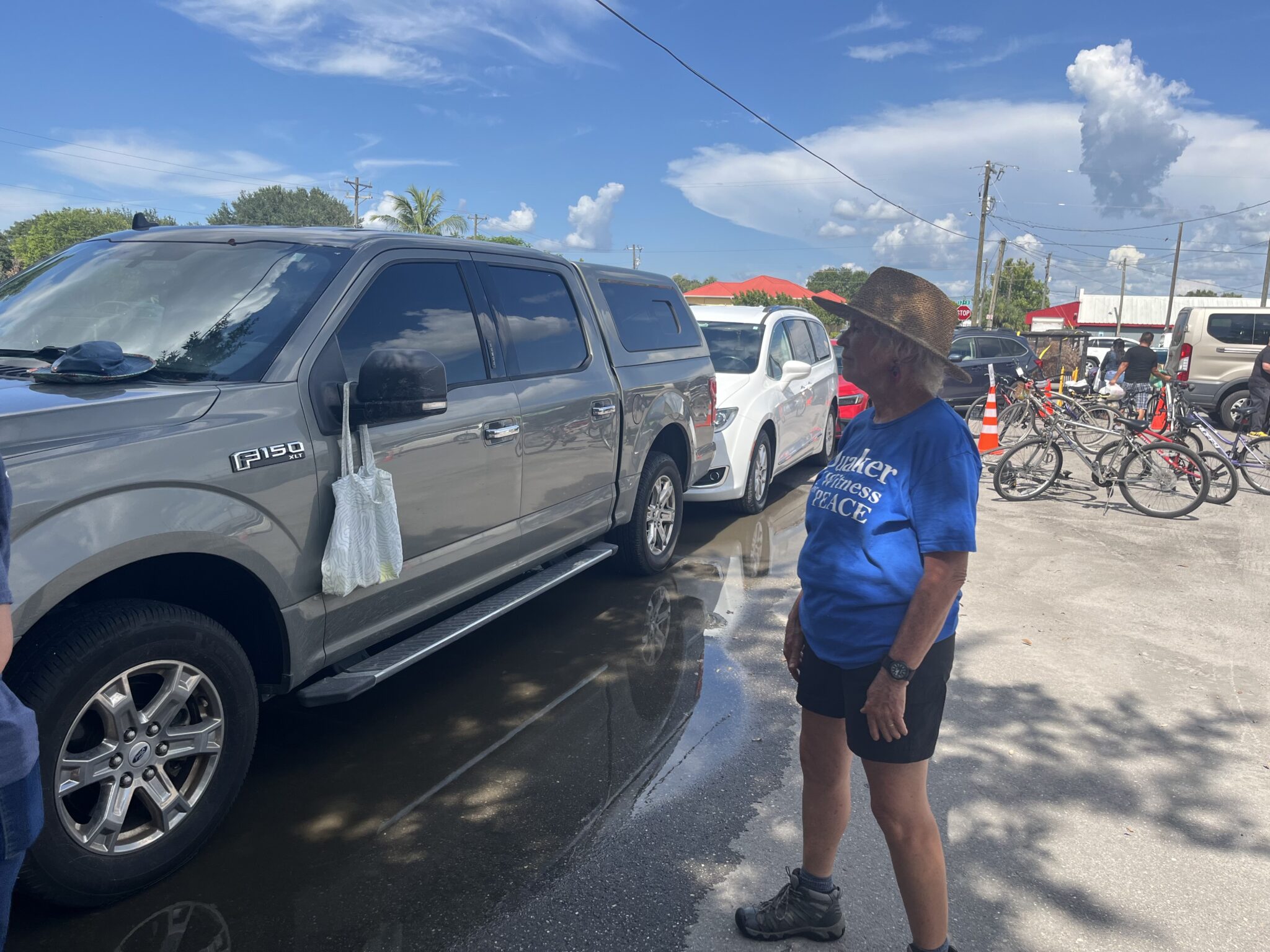 A person standing near cars to direct traffic