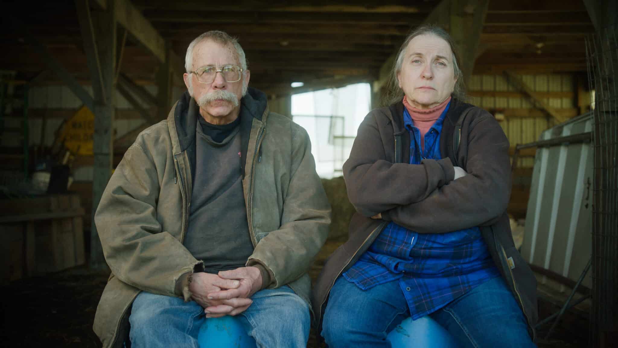 Two farmers sitting side-by-side