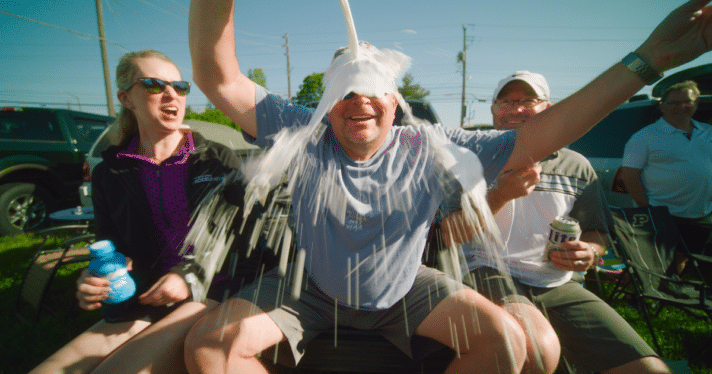 A man pouring milk on himself