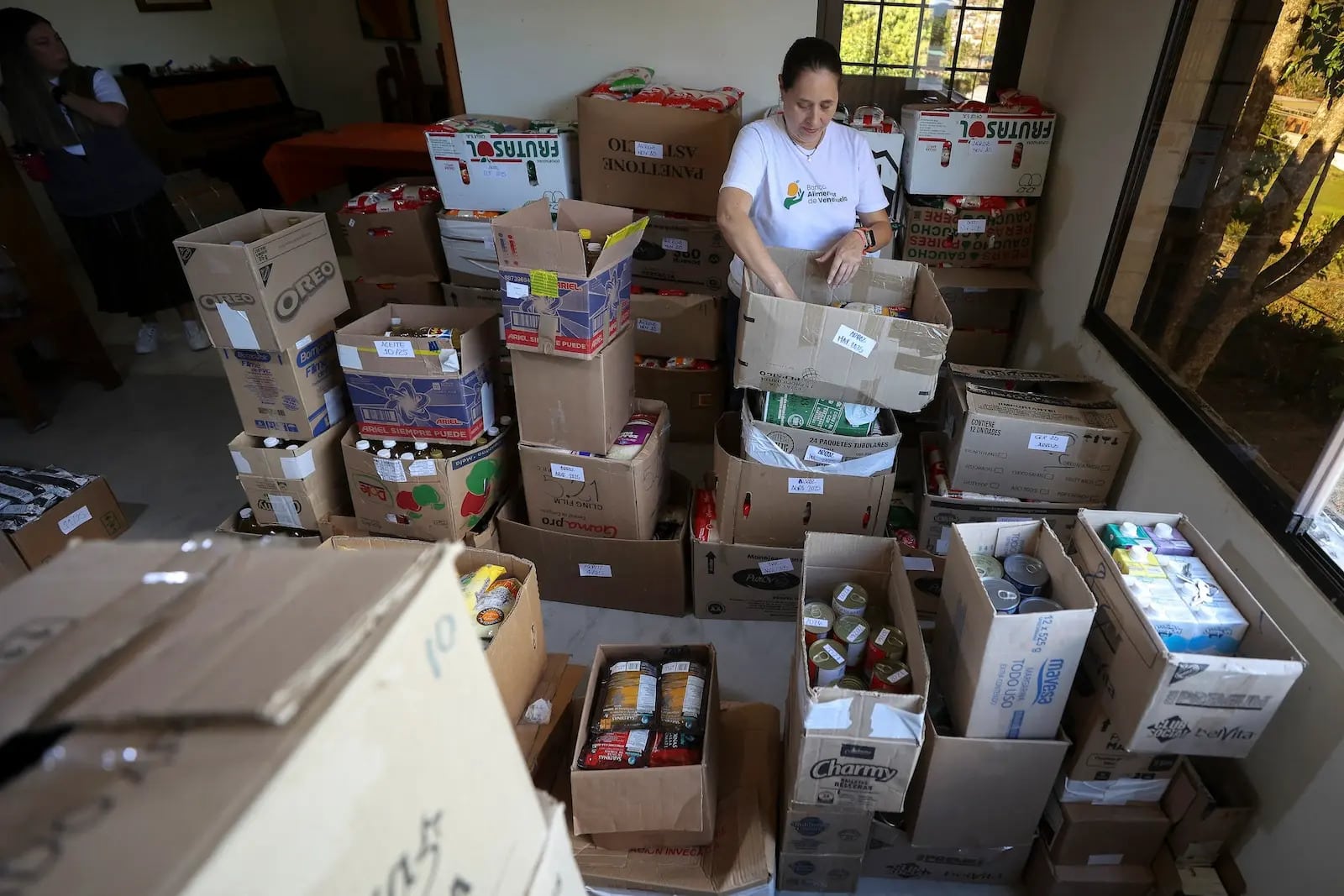 A person sorting boxes of food