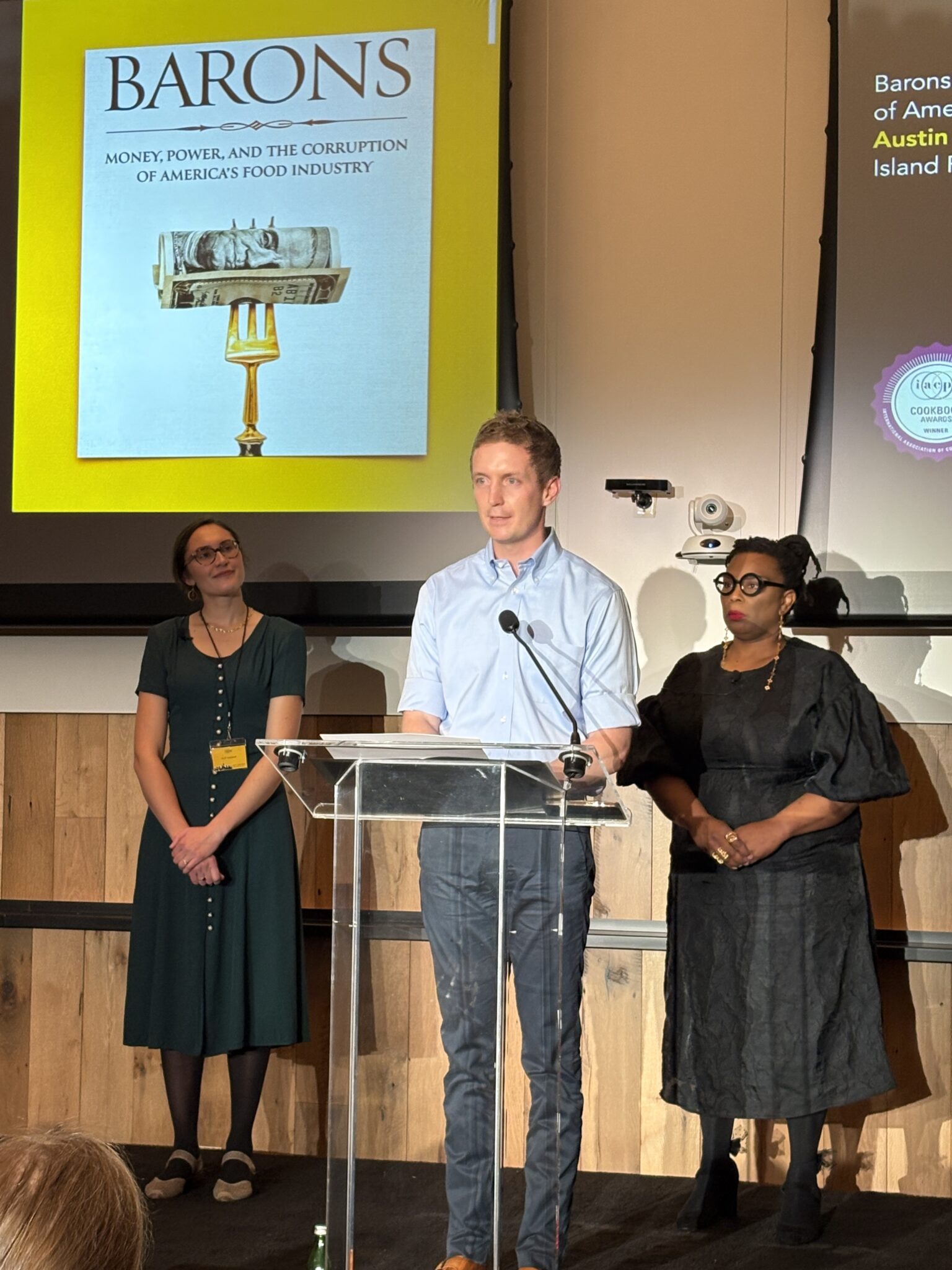 A man presenting at a podium