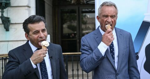 Food and Drug Administration Commissioner (FDA) Martin Makary and Secretary of Health and Human Services Robert F. Kennedy Jr., eat ice cream at the end of a news conference at the USDA headquarters building in Washington, DC, on July 14, 2025.