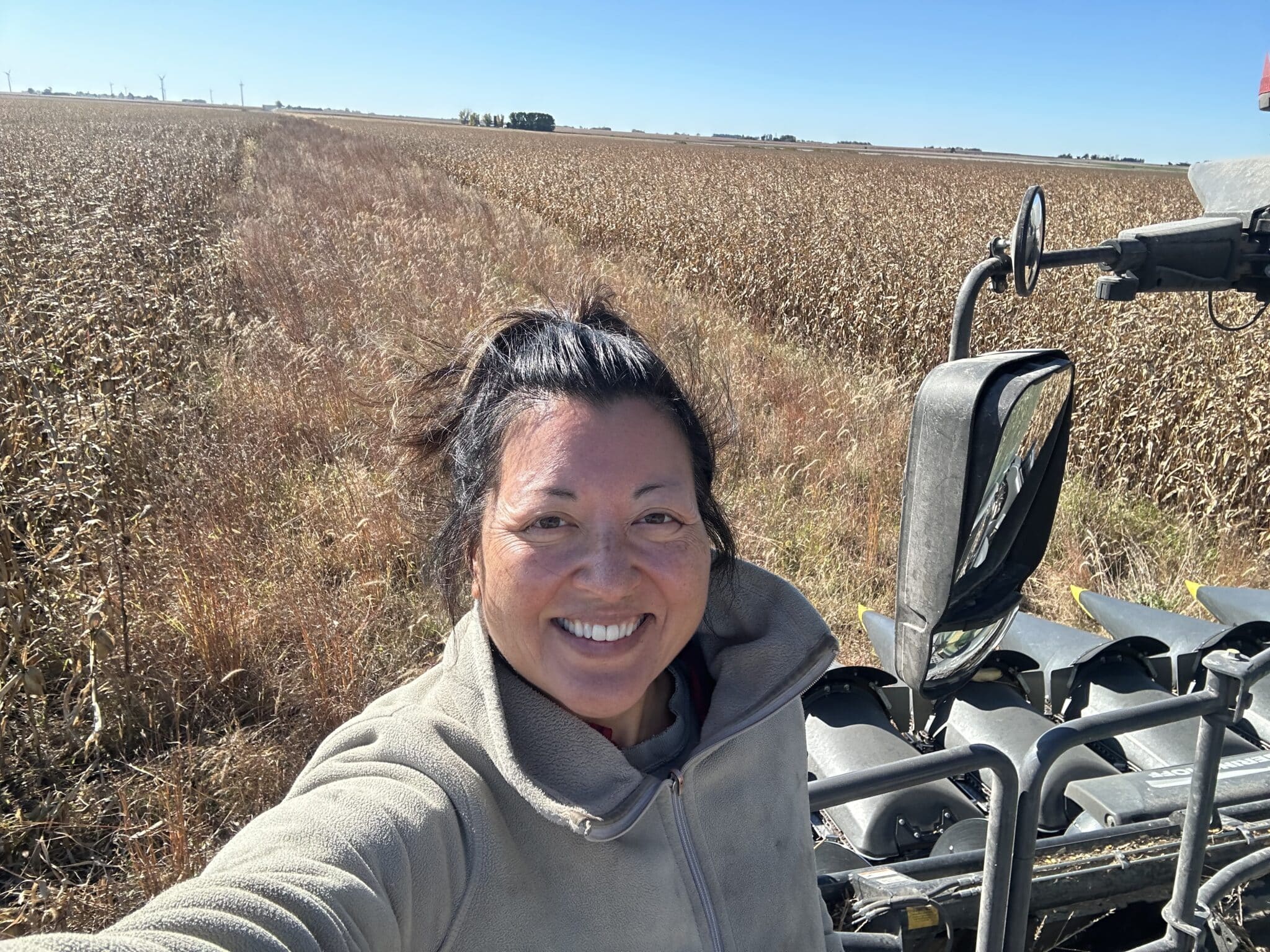 A woman out in the fields of a farm