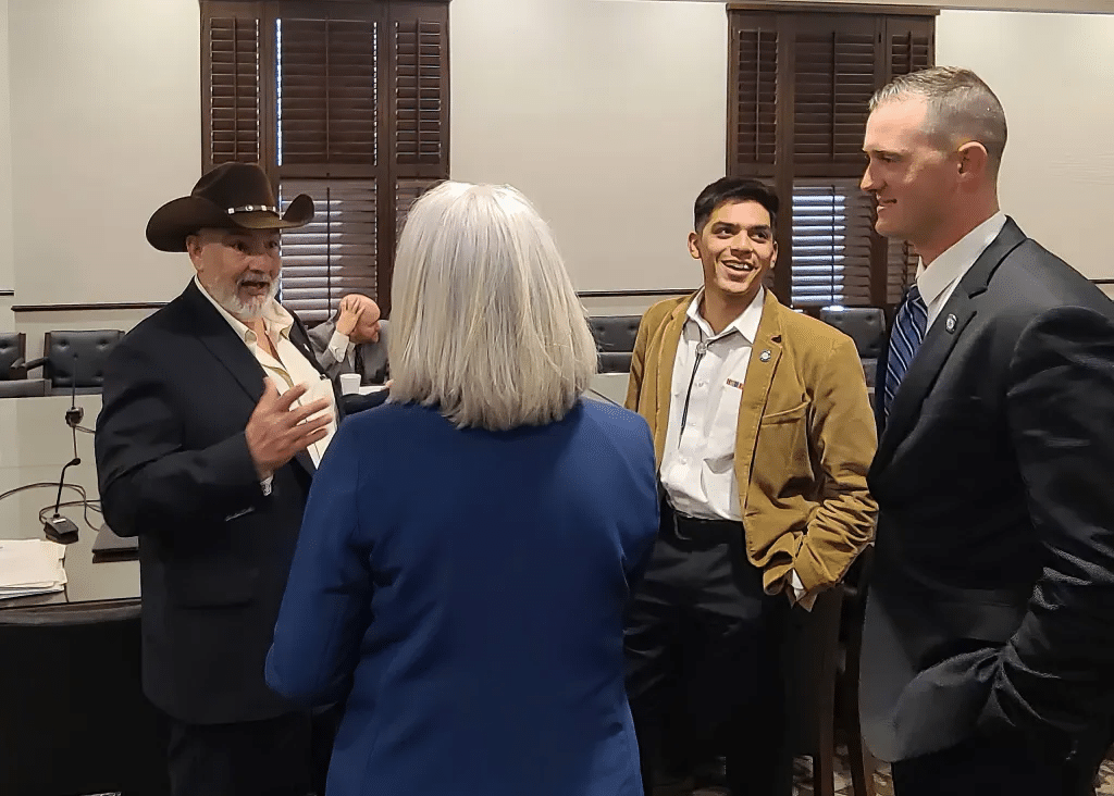 A group of representatives talking with one another