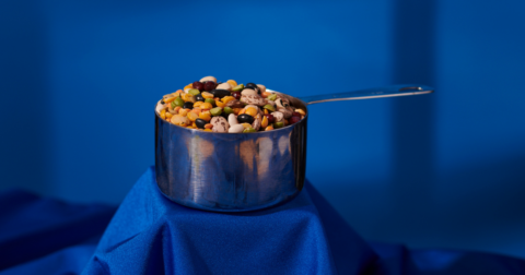 A cup of beans, peas, and lentils