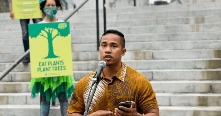 A man speaking into a microphone