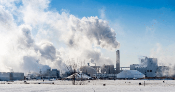 A grain processing plant producing smoke