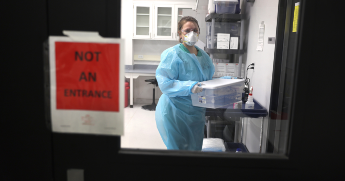 A microbiologist in a testing lab