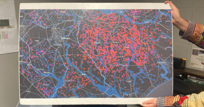 A map with blue lines and many red dots