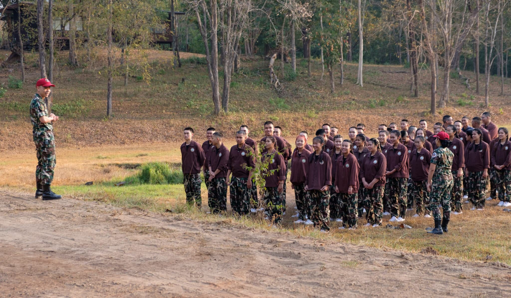 A group of students receiving a forestry class out in nature