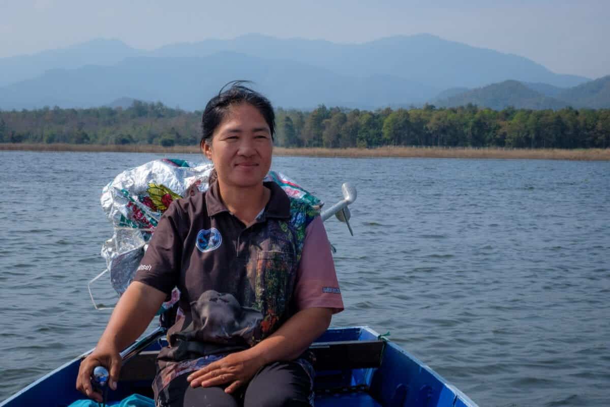 A person sitting in a boat on the water