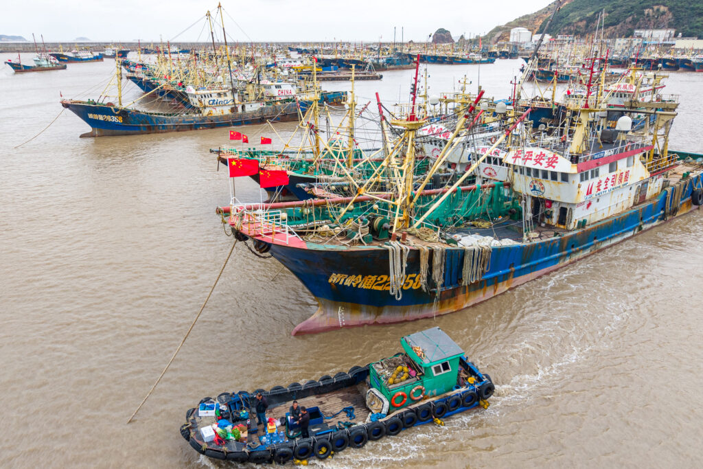 Multiple Chinese fishing vessels out on the water