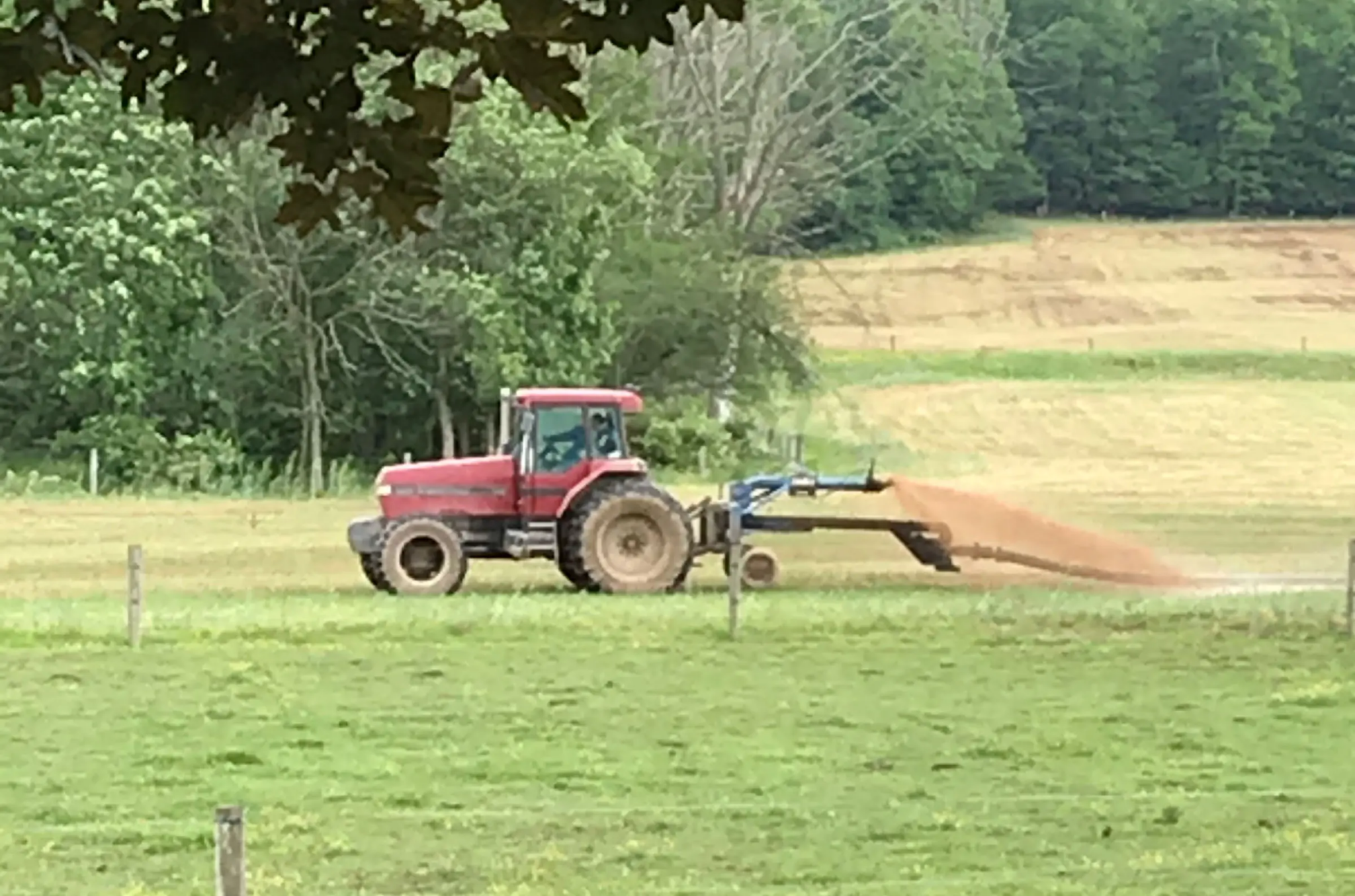 A tractor spraying food processing residuals