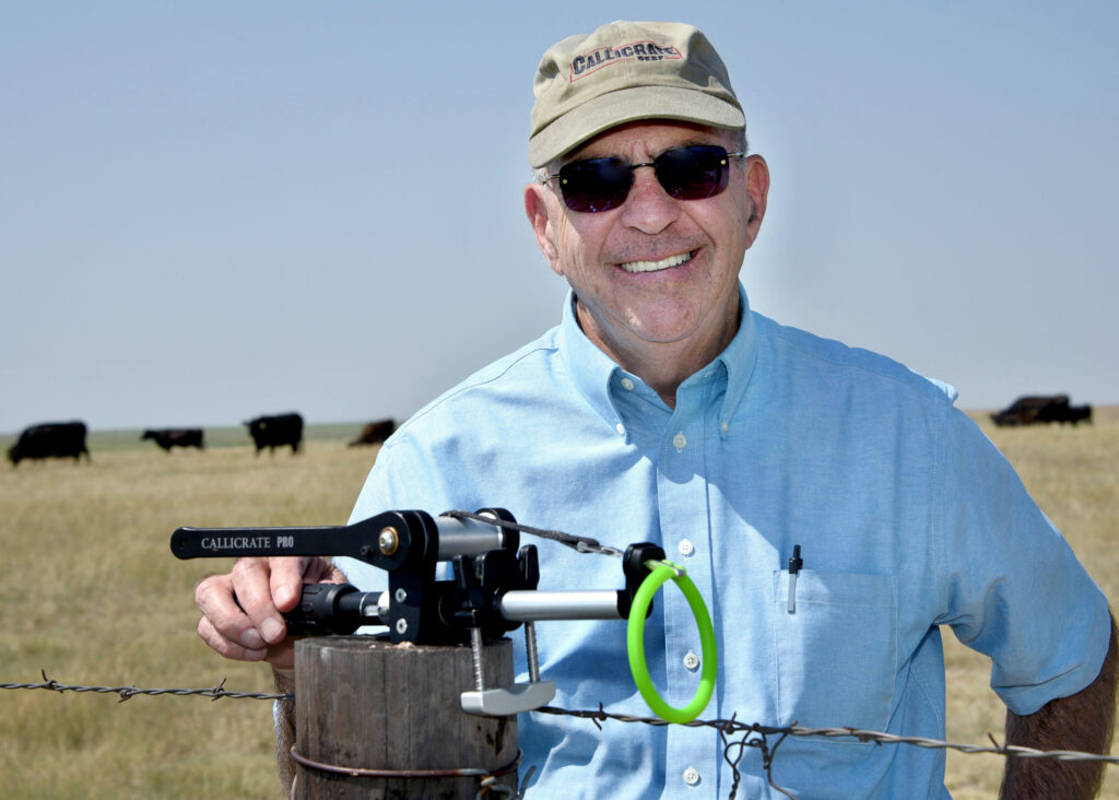 A man with a bull castration device