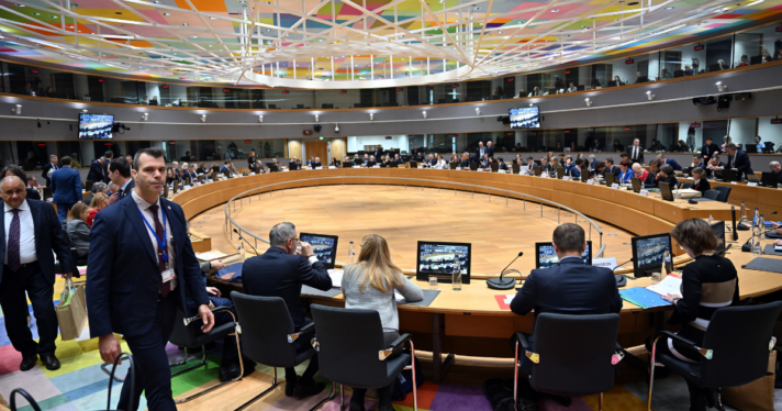 The European Union Agriculture Ministers holding a meeting at a large, circular table