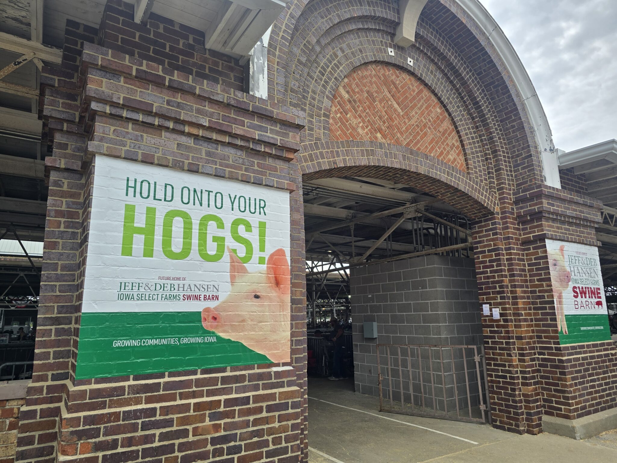 A building with a poster outside with a pig on it